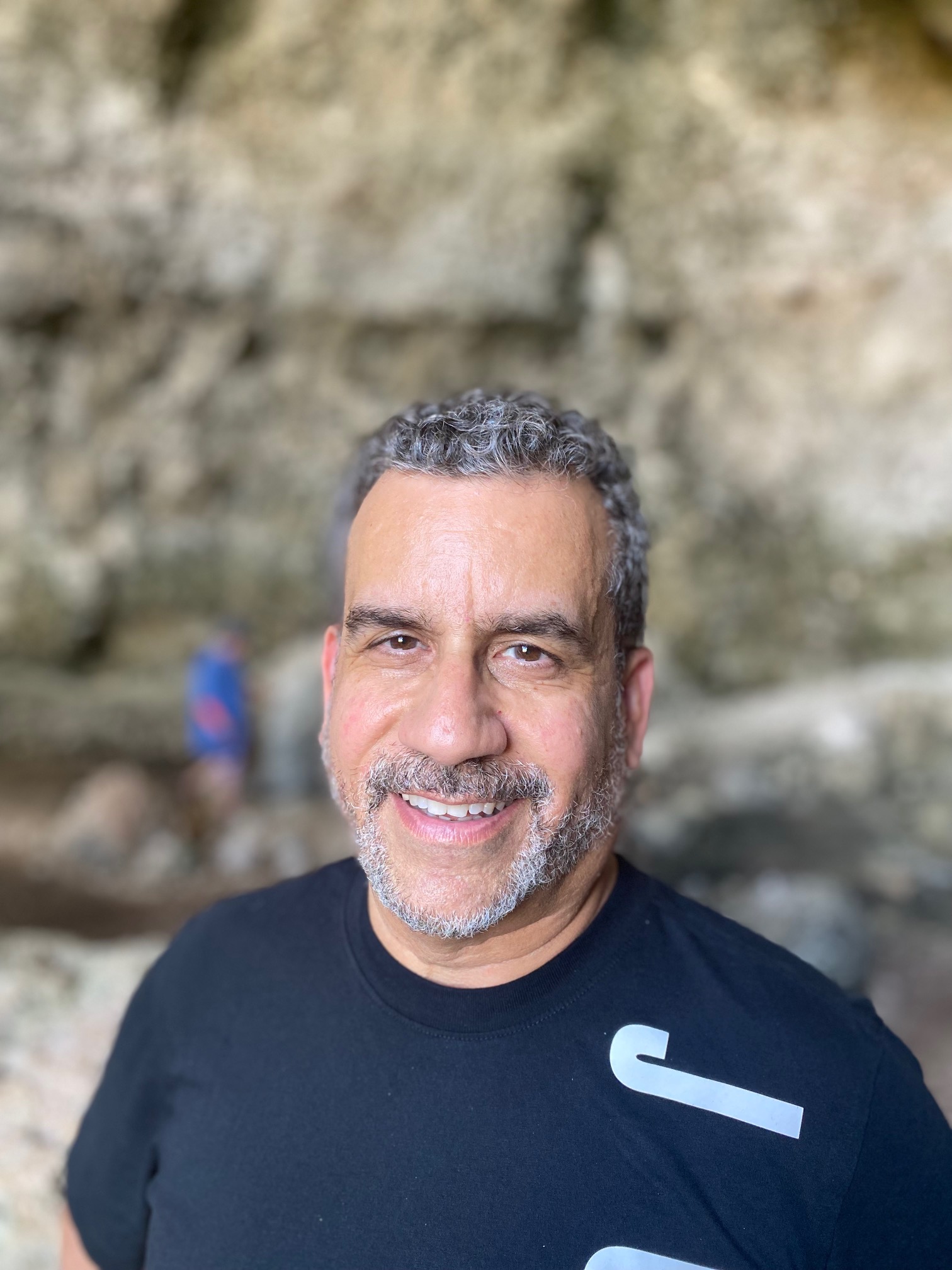 Portrait of Jeff smiling in a black shirt
